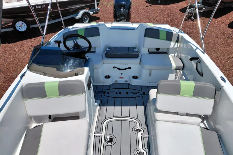 Slide: The Image of 2023 Tahoe T18 boat interior with modern seating and steering wheel. - 20