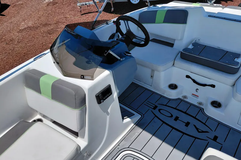 Slide: The Image of 2023 Tahoe T18 boat interior with modern seating and steering console. - 21