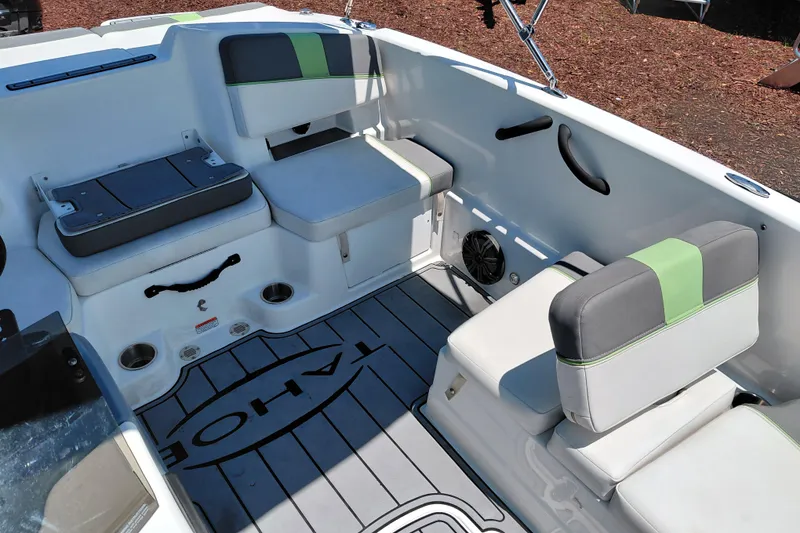 Slide: The Image of 2023 Tahoe T18 boat interior with cushioned seating and modern design. - 22