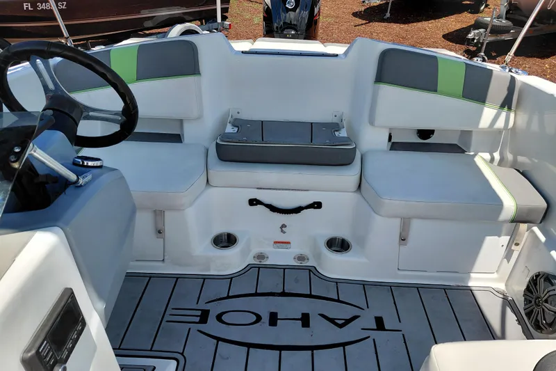 Slide: The Image of 2023 Tahoe T18 boat interior with seating and steering wheel. - 23