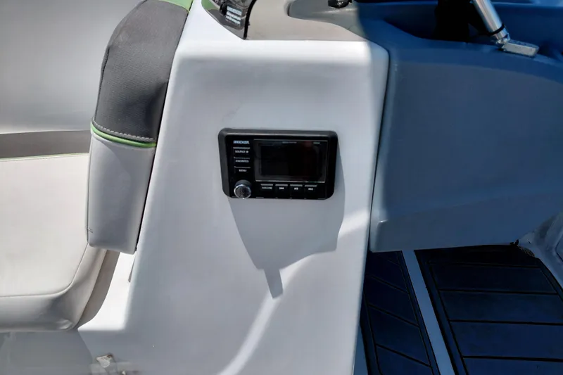 Slide: The Image of 2023 Tahoe T18 boat interior with control panel and seating. - 26