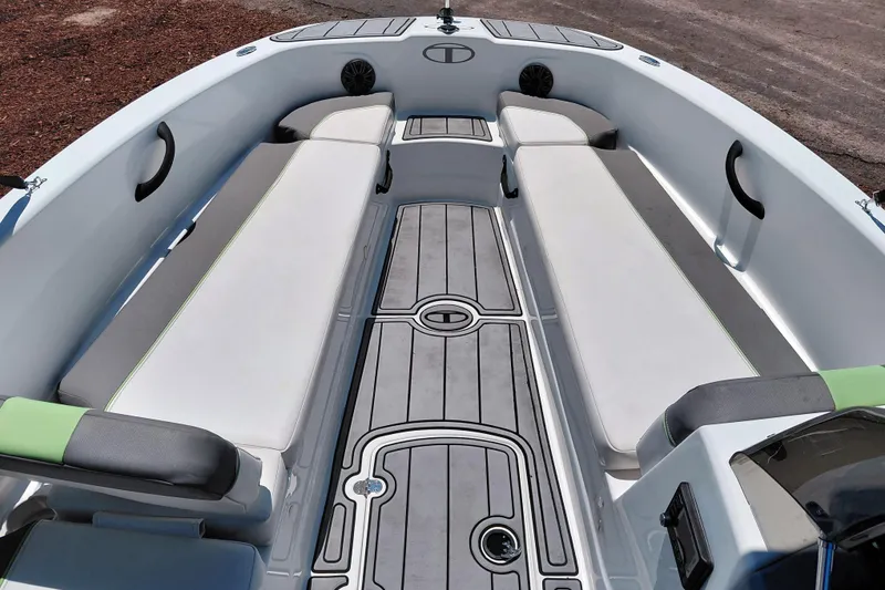 Slide: The Image of 2023 Tahoe T18 boat interior with cushioned seating and sleek flooring design. - 30