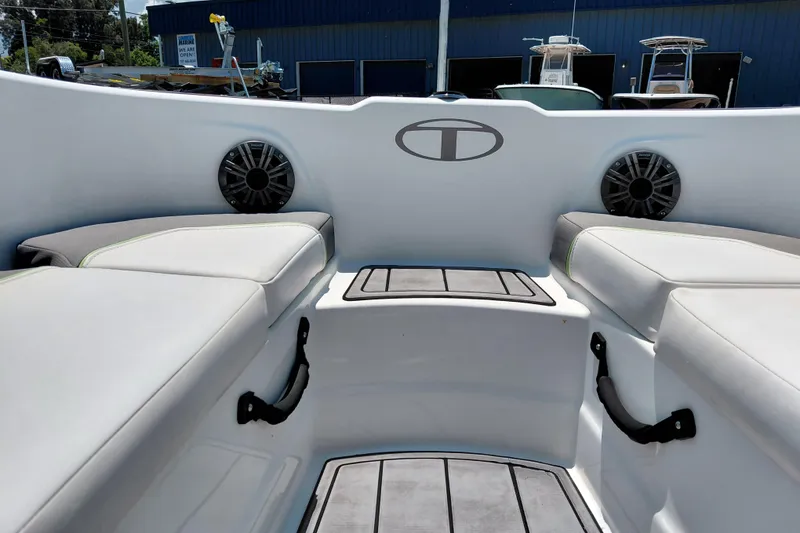 Slide: The Image of Interior of 2023 Tahoe T18 boat with cushioned seating and speakers. - 31