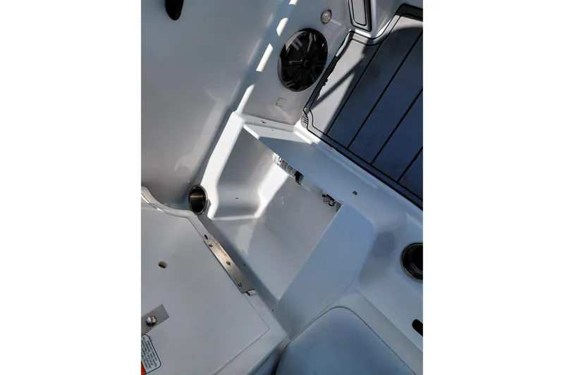 Slide: The Image of 2023 Tahoe T18 boat interior with seating, speaker, and cup holder. - 33