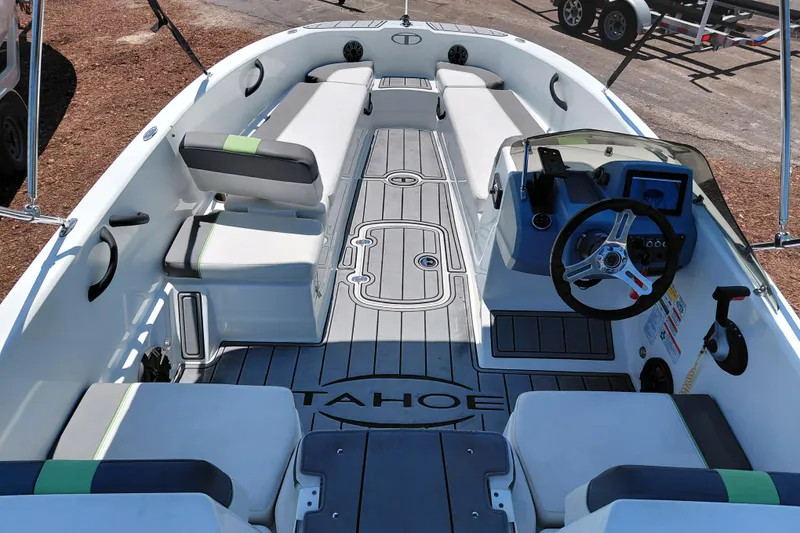 Slide: The Image of 2023 Tahoe T18 boat interior with seating, steering wheel, and modern design. - 40