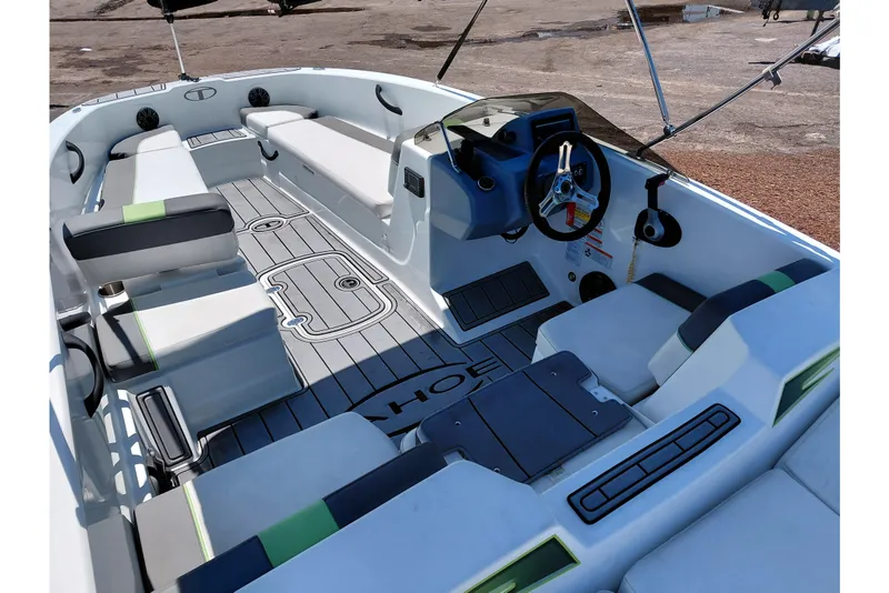 Slide: The Image of 2023 Tahoe T18 boat interior with modern seating and steering console. - 46
