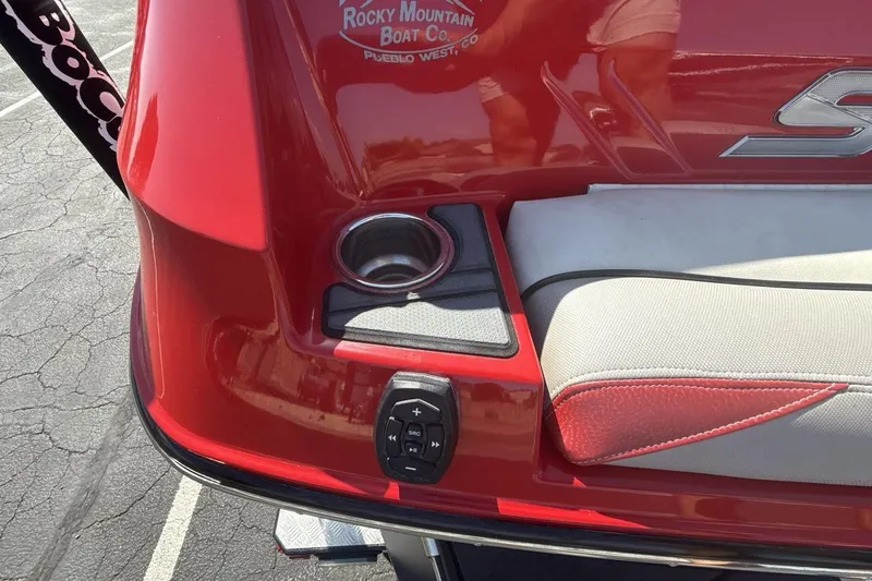Slide: The Image of 2016 Supra SE 550 boat rear detail with cup holder and control panel. - 26