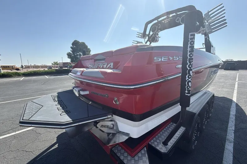 Slide: The Image of 2016 Supra SE 550 boat in parking lot, rear view with wakeboard tower. - 5