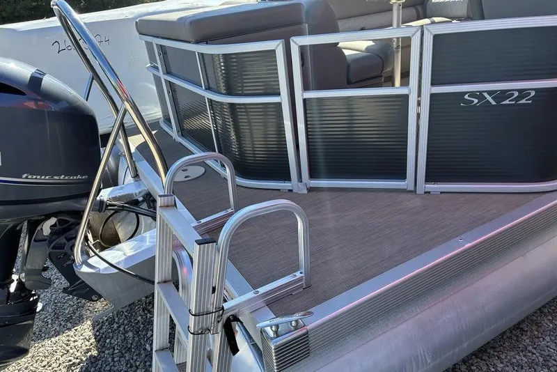 Slide: The Image of 2019 Bennington SX 22 SLXP pontoon boat with four-stroke engine and boarding ladder. - 5