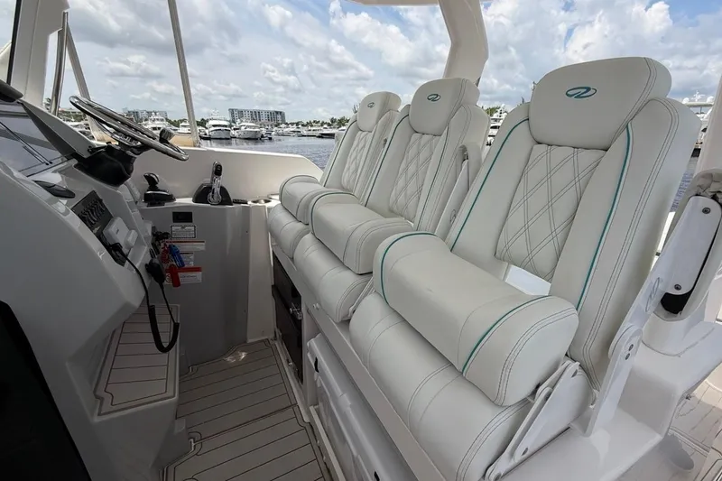 Slide: The Image of Luxurious interior of 2021 Regal 33 SAV boat with plush seating and modern controls. - 14