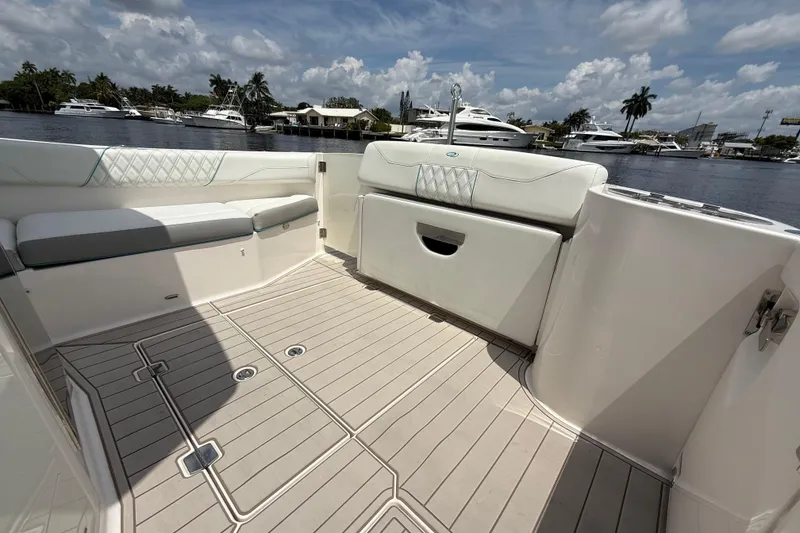 Slide: The Image of Luxurious 2021 Regal 33 SAV boat interior with elegant seating and scenic waterfront view. - 8