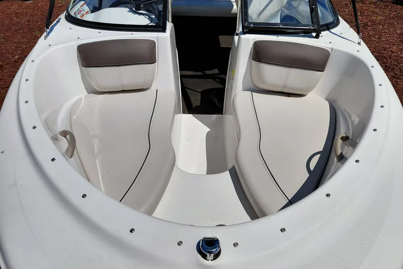 Slide: The Image of 2021 Bayliner 160 Bowrider boat interior with white seating and sleek design. - 29