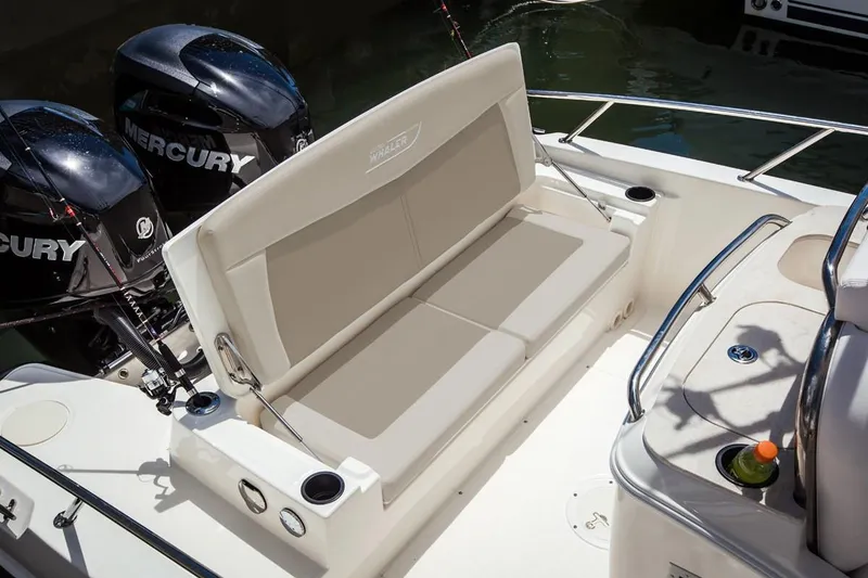 Slide: The Image of Manufacturer Provided Image: Boston Whaler 270 Dauntless 2020 boat with twin Mercury engines and cushioned seating. - 10