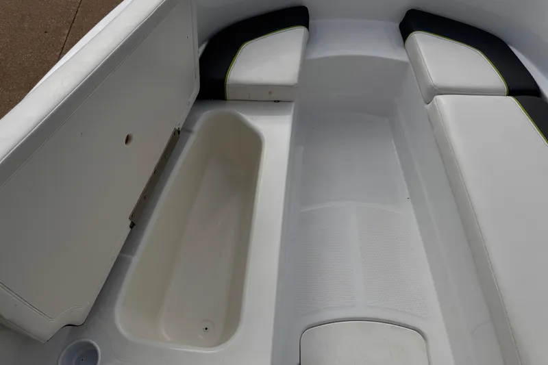 Slide: The Image of Interior view of 2021 Tahoe T16 boat with seating and storage compartment. - 2