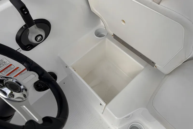Slide: The Image of 2021 Tahoe T16 boat interior with steering wheel and storage compartment. - 5