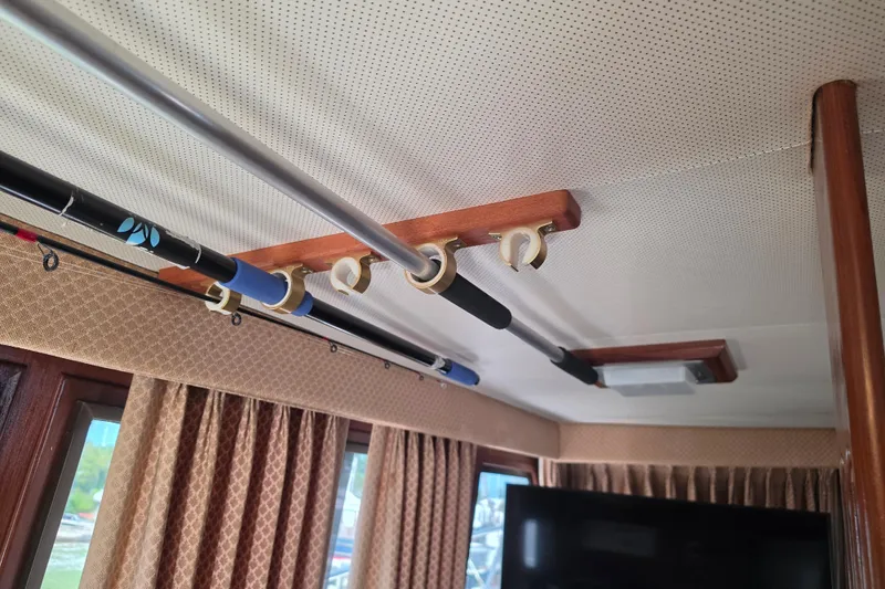Slide: The Image of Interior of a 1985 Hatteras 52 Convertible yacht with dining area and kitchen. - 14