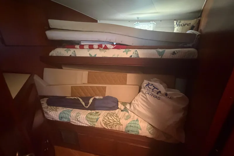 Slide: The Image of Cozy cabin interior of 1985 Hatteras 52 Convertible with bunk beds and nautical decor. - 34