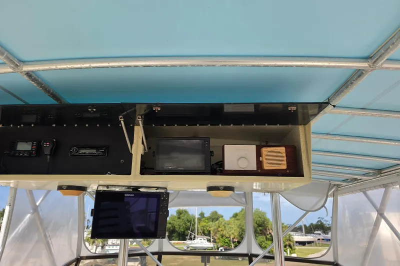Slide: The Image of Interior view of 1985 Hatteras 52 Convertible boat cockpit with navigation equipment. - 50