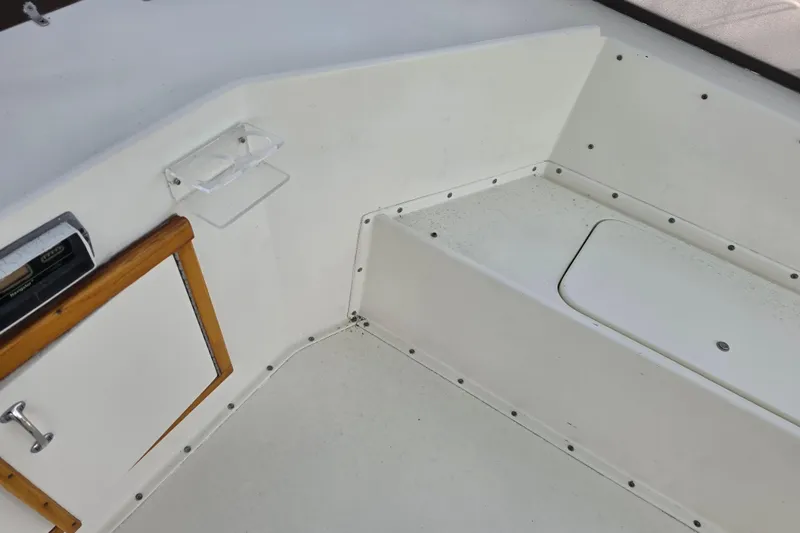 Slide: The Image of Interior view of a 1985 Hatteras 52 Convertible boat, featuring storage compartments. - 58