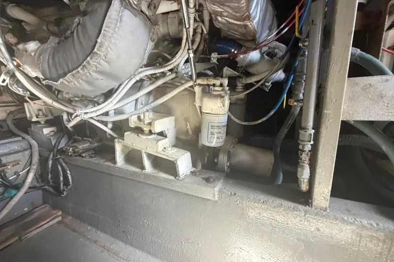 Slide: The Image of Engine compartment of a 1985 Hatteras 52 Convertible yacht, showcasing mechanical components. - 75