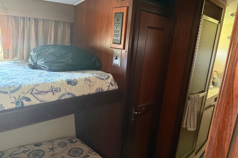 Slide: The Image of Interior of 1985 Hatteras 52 Convertible yacht with bunk beds and bathroom. - 9