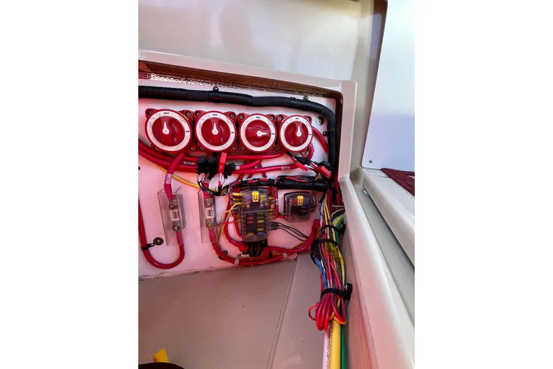 Slide: The Image of Electrical panel of 2017 Ranger Tugs R-27 boat with switches and wiring. - 12