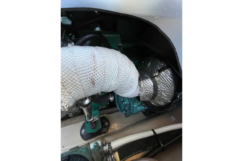 Slide: The Image of Engine compartment of a 2017 Ranger Tugs R-27, showcasing insulated components. - 14