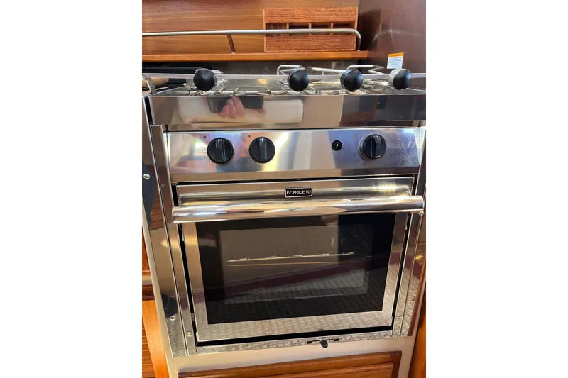 Slide: The Image of Stainless steel oven in 2017 Ranger Tugs R-27 boat kitchen. - 26