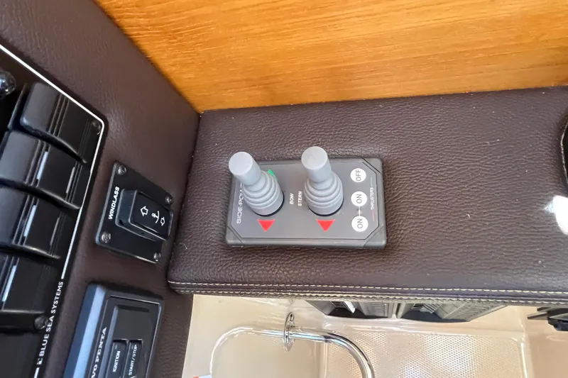 Slide: The Image of Control panel of a 2017 Ranger Tugs R-27 boat with joystick and switches. - 27