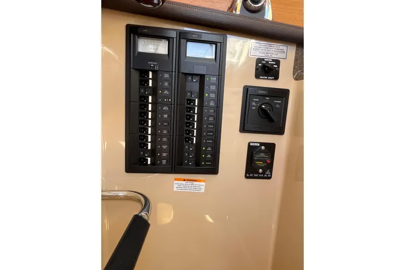 Slide: The Image of Electrical panel of 2017 Ranger Tugs R-27 boat with switches and controls. - 30