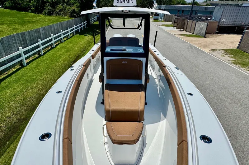 Slide: The Image of 2024 Sea Hunt Gamefish 27 Coffin Box boat with brown seating and Garmin equipment. - 15