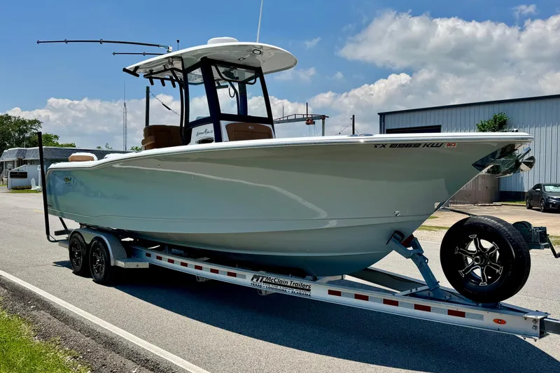 Slide: The Image of 2024 Sea Hunt Gamefish 27 Coffin Box boat on trailer, parked outdoors. - 5