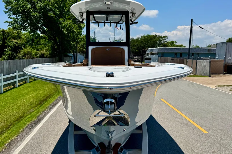 Slide: The Image of 2024 Sea Hunt Gamefish 27 Coffin Box boat on a sunny street, front view. - 6