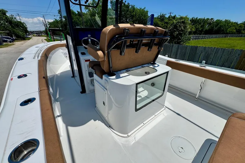 Slide: The Image of 2024 Sea Hunt Gamefish 27 Coffin Box boat interior with seating and storage. - 8