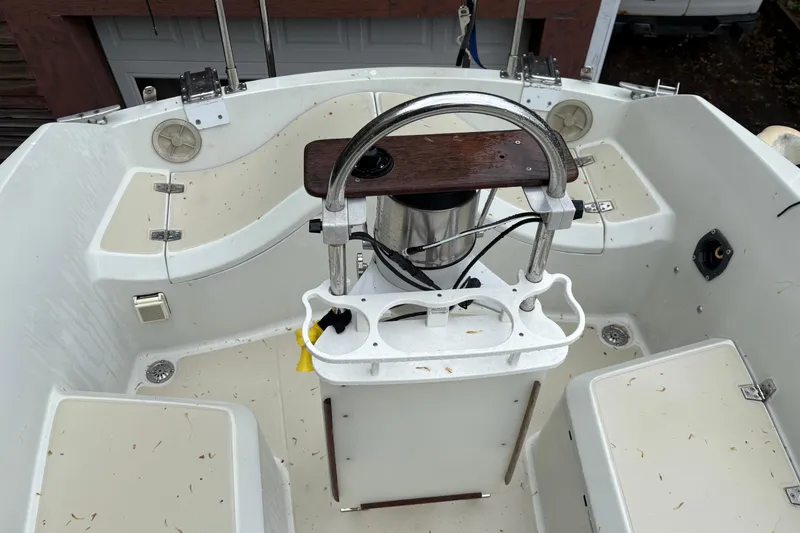 Slide: The Image of Cockpit of a 1987 Ericson 28/2 sailboat with steering wheel and seating. - 10