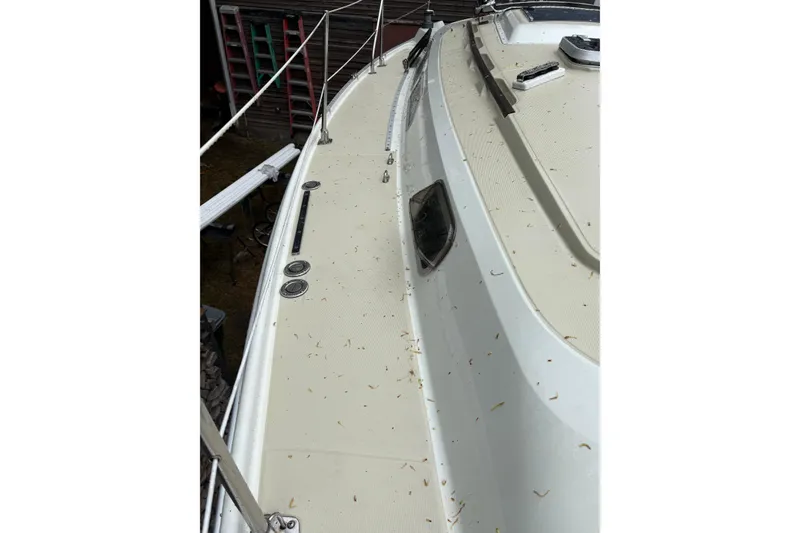 Slide: The Image of 1987 Ericson 28/2 sailboat deck with railing and hatch details. - 20