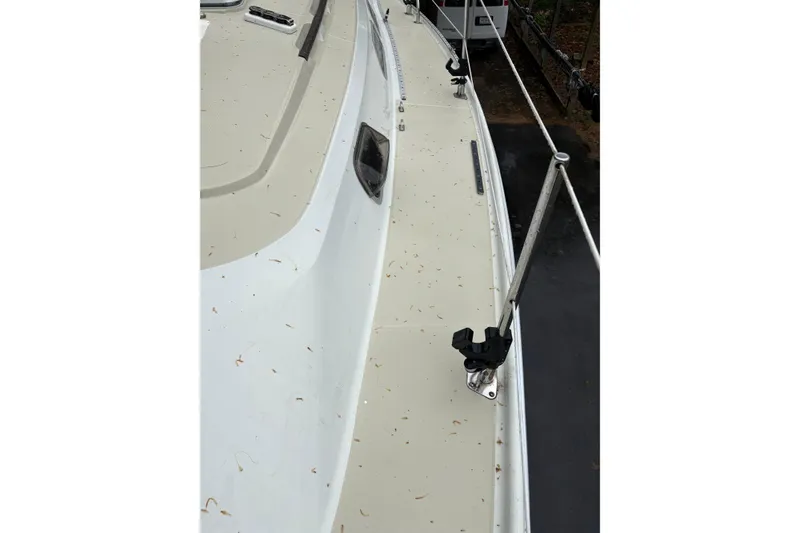 Slide: The Image of 1987 Ericson 28/2 sailboat deck with railing and fittings, showing clean surface. - 21