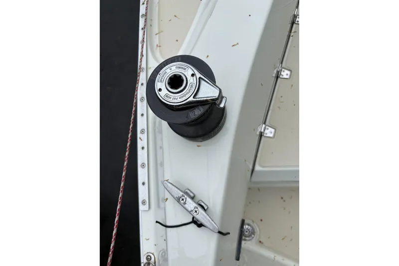 Slide: The Image of Close-up of a 1987 Ericson 28/2 sailboat winch and cleat on deck. - 24
