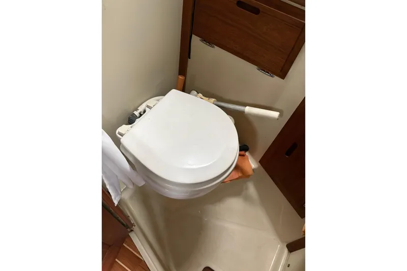 Slide: The Image of Compact marine toilet in 1987 Ericson 28/2 sailboat bathroom. - 34