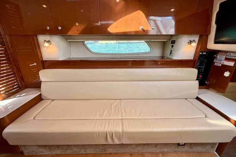 Slide: The Image of Luxurious interior of 2009 Sea Ray Sundancer 350 with beige leather seating. - 12