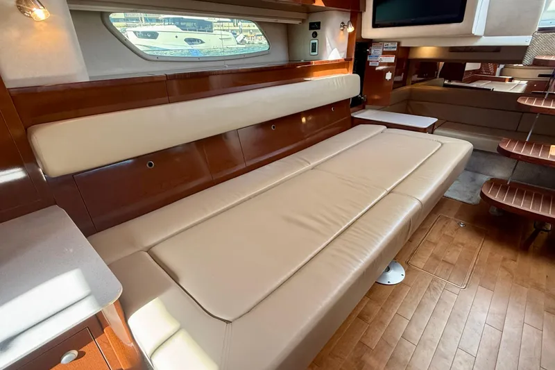 Slide: The Image of Luxurious interior of 2009 Sea Ray Sundancer 350 yacht with beige leather seating. - 16