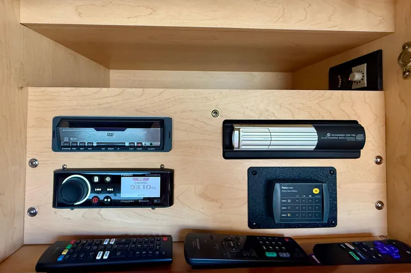 Slide: The Image of Control panel of a 2009 Sea Ray Sundancer 350 with audio system and remotes. - 17