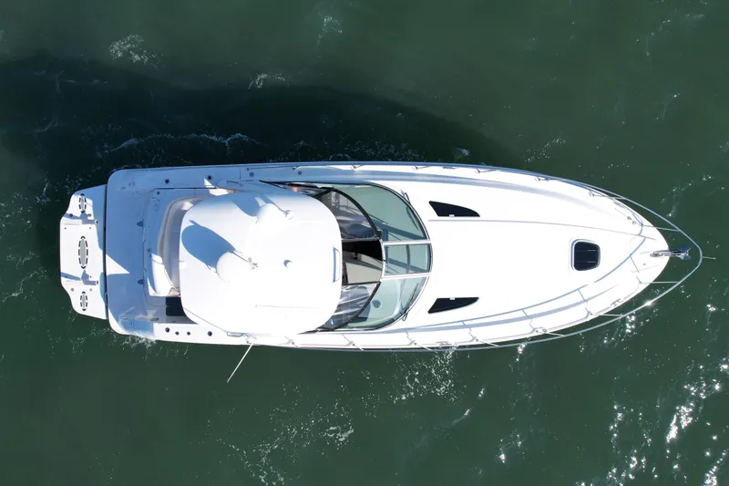 Slide: The Image of Aerial view of 2009 Sea Ray Sundancer 350 yacht on open water. - 2