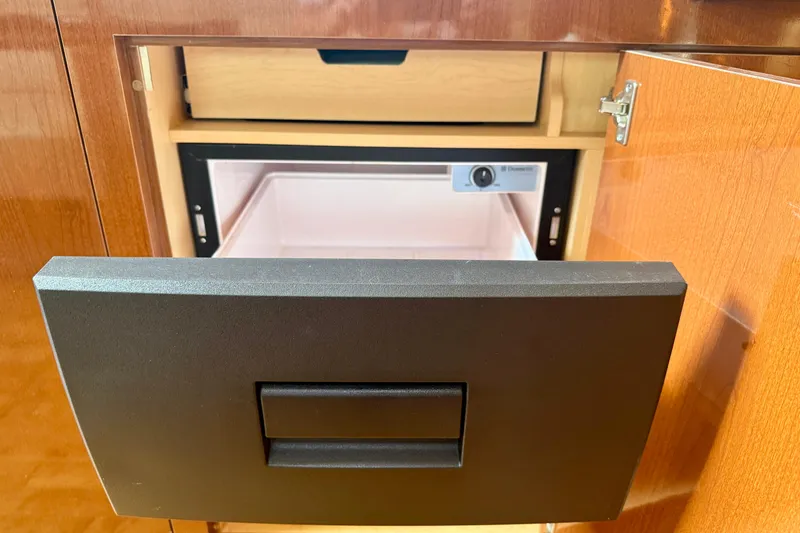 Slide: The Image of Open cabinet with drawer in 2009 Sea Ray Sundancer 350 yacht interior. - 34