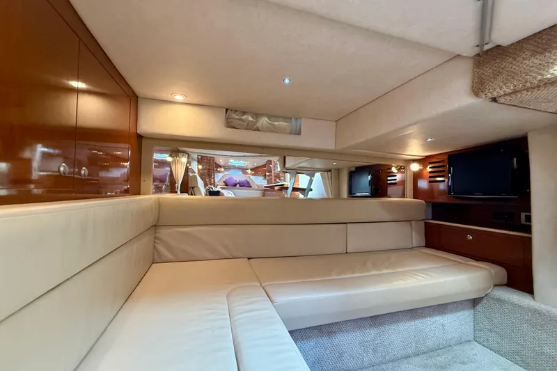 Slide: The Image of Luxurious interior of 2009 Sea Ray Sundancer 350 yacht with plush seating and wood accents. - 39