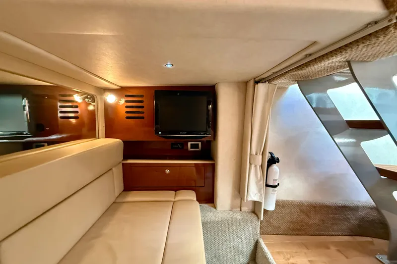Slide: The Image of Interior of 2009 Sea Ray Sundancer 350 with TV, seating, and modern design elements. - 40