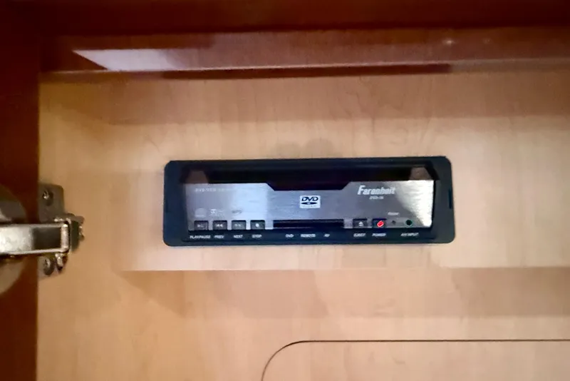 Slide: The Image of DVD player installed in a 2009 Sea Ray Sundancer 350 yacht interior cabinet. - 44