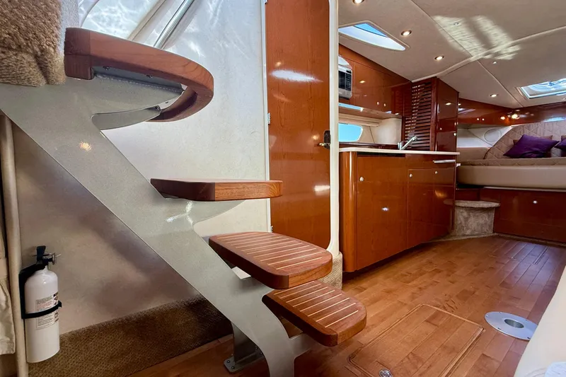 Slide: The Image of Luxurious interior of 2009 Sea Ray Sundancer 350 yacht with wooden stairs and modern kitchen. - 45