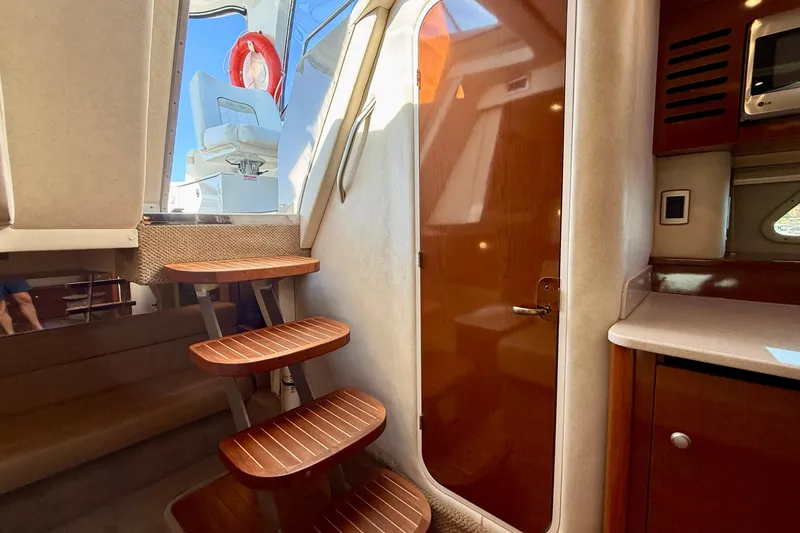 Slide: The Image of Interior view of 2009 Sea Ray Sundancer 350 yacht with wooden steps and cabin door. - 46