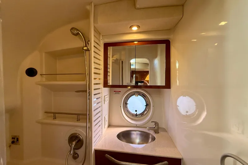 Slide: The Image of Luxurious bathroom in 2009 Sea Ray Sundancer 350 yacht with sink, mirror, and shower. - 48